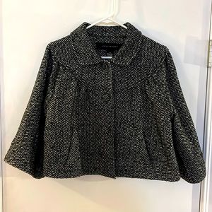 Apostrophe cropped pea swing coat.